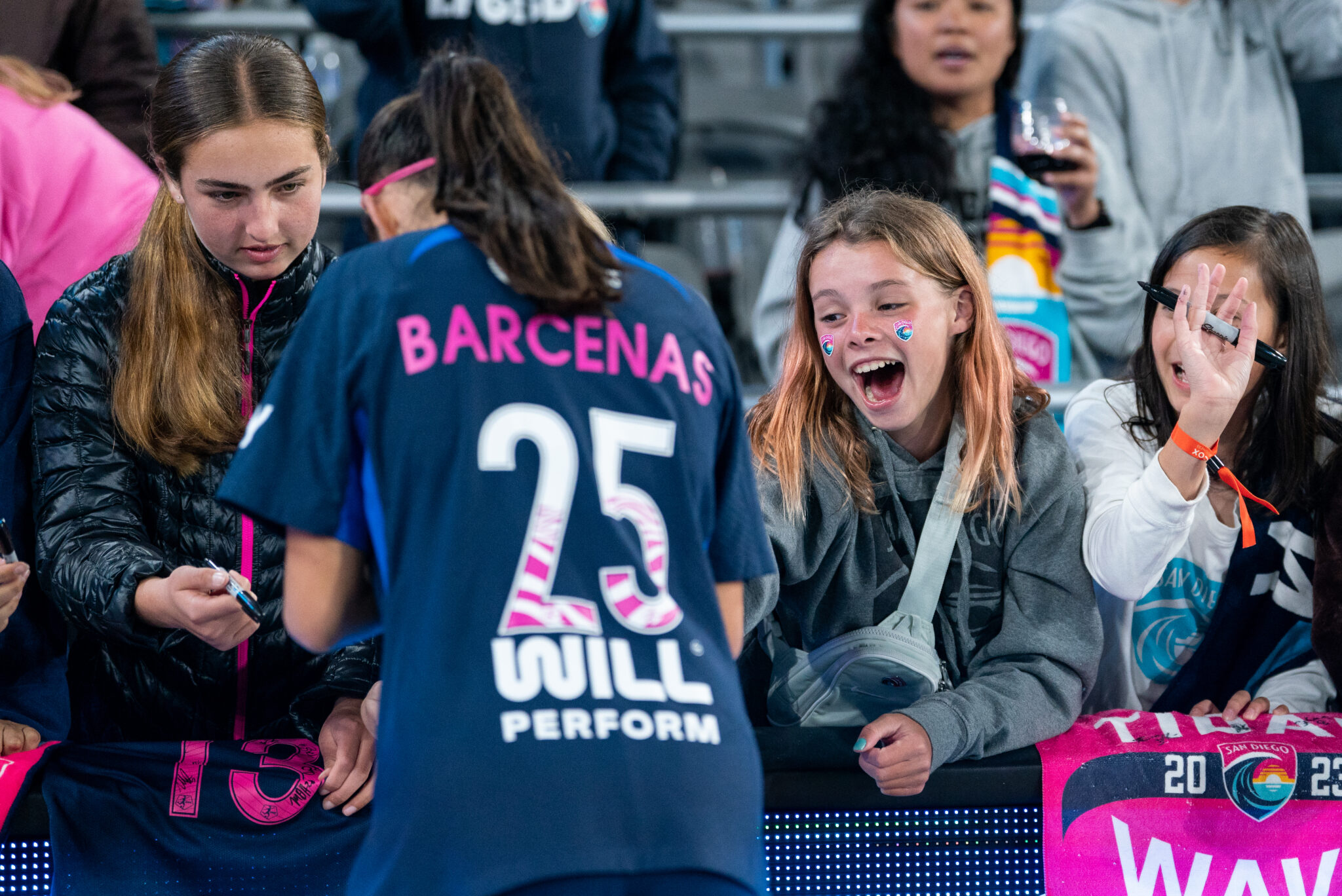 After the game, forward and #25 Barcenas interacts with fans after her debut performance against Orlando Pride.