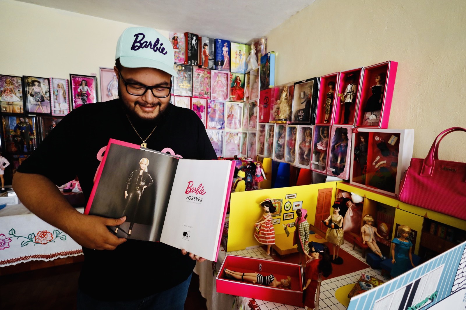 Dr. Paul Sebastian Juarez Velasquez and his prized Barbie collection.